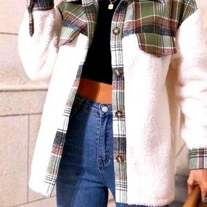 Super cute crest jacket with plaid detail.